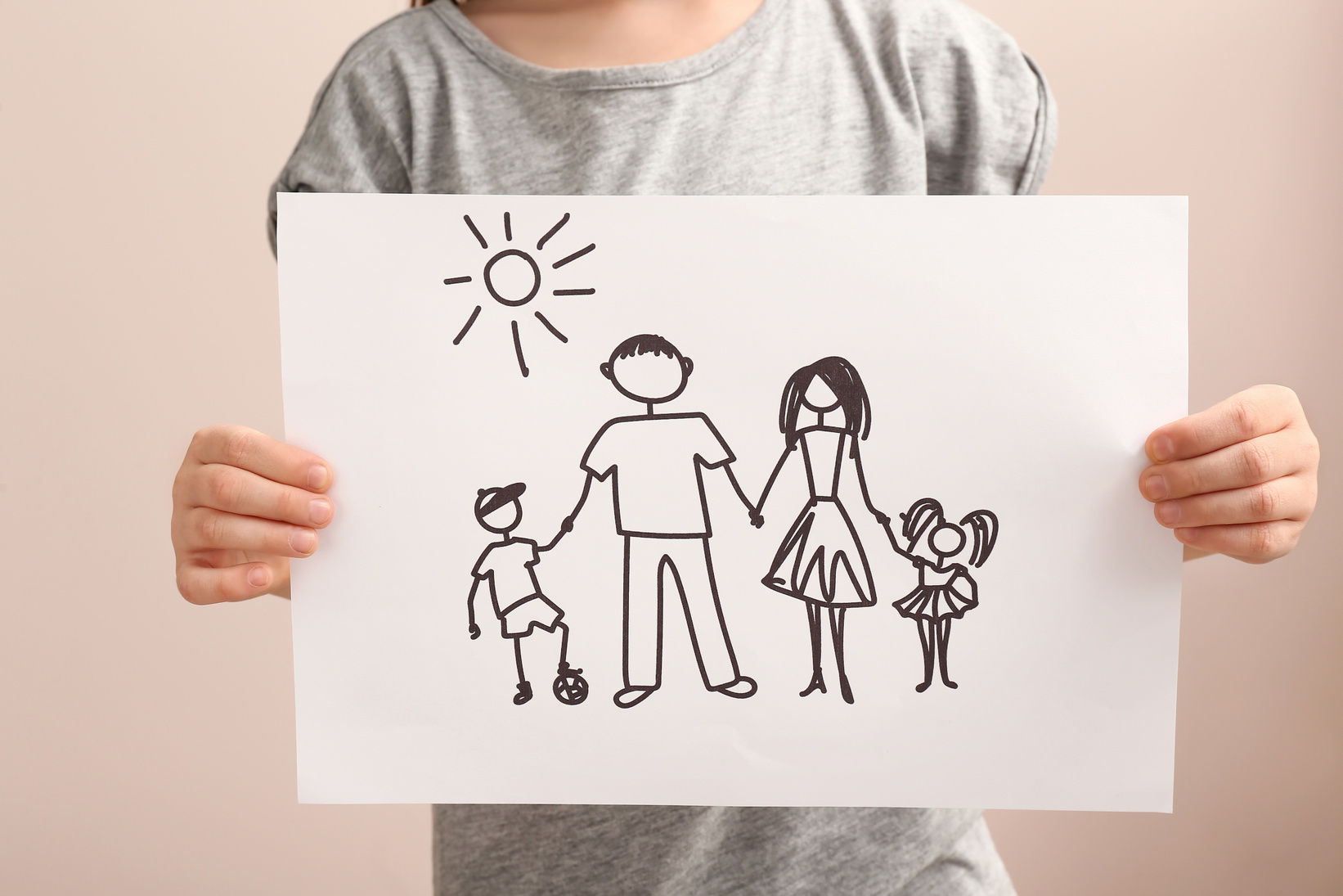 Child with Drawing of Family. Concept of Adoption